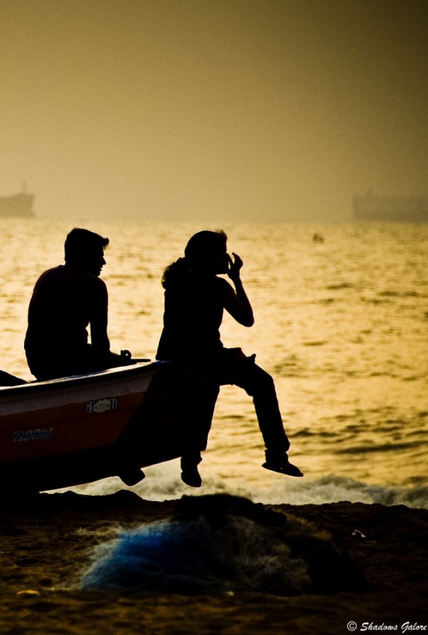 A couple sitting on a boat Chennai-scape: Silhouettes at Marina Beach 4
